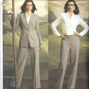 May include: A sewing pattern envelope for an Anne Klein Vogue American Designer suit featuring a single-button blazer and straight-leg trousers in a neutral taupe fabric, paired with a white wrap-style long-sleeve top, labeled as pattern 2759.