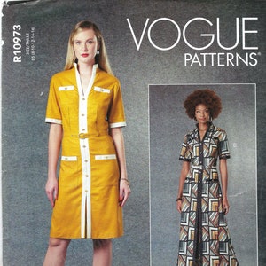 May include: Vogue Patterns sewing pattern for two dresses, one yellow with white trim and a button-down front, and one long, black, white, and brown geometric print dress. The pattern number is R10973.