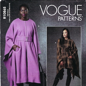 May include: Vogue Patterns sewing pattern for two different styles of capes. The first cape is a long, purple, belted cape with a zipper closure. The second cape is a shorter, brown and black plaid cape with a brown belt. The pattern is for sizes XS-M.