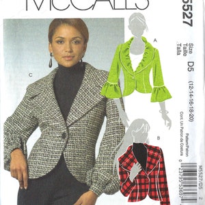 May include: McCall's sewing pattern M5527 featuring three jacket designs. The main image shows a woman wearing a tweed jacket. Other designs include a green jacket with ruffled sleeves and a red plaid jacket.