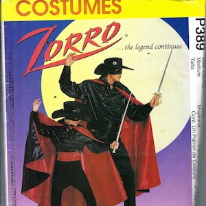 May include: McCall's Costumes Zorro sewing pattern. The image shows two figures in Zorro costumes, complete with black capes, hats, and masks, holding swords. The pattern envelope is yellow and features the Zorro logo and text "...the legend continues."