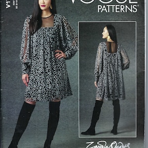 May include: Vogue Patterns sewing pattern for a black and white dress with a sheer overlay and long sleeves. The pattern is designed by Zandra Rhodes and includes sizes 8-10-12-14-16.