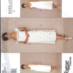 May include: Vogue pattern featuring three dress designs by Marc Jacobs. The designs include a white spaghetti strap dress, a floral print dress with short sleeves, and a white dress with a V-neck. The pattern includes sizes 6-8-10.