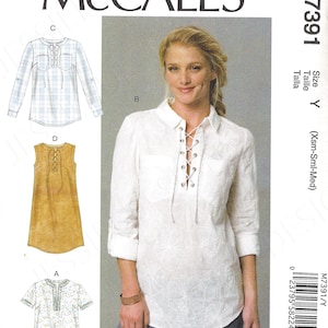 May include: A sewing pattern for a women's top with a lace-up neckline. The pattern includes four different styles: a white top with a lace-up neckline, a blue and white plaid top with a lace-up neckline, a brown sleeveless top with a lace-up neckline, and a white and blue floral print top with a lace-up neckline. The pattern is for sizes X-Small, Small, and Medium. The pattern number is M7391/Y.
