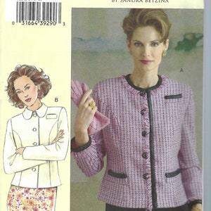 May include: A sewing pattern for a jacket and skirt. The pattern shows a pink tweed jacket with black trim and buttons. The pattern also includes a white jacket and floral skirt design. The text "TODAY'S FIT" is visible.