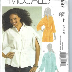 May include: A sewing pattern for a shirt with a tie belt. The pattern is for sizes 6-8-10-12 and is called McCall's M5587. The pattern includes three different views of the shirt, one in white, one in yellow, and one in blue.