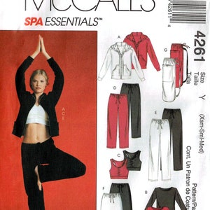 May include: McCall's Spa Essentials sewing pattern. The image shows a woman in yoga pose wearing black pants, a white top, and a black jacket. The pattern includes designs for a hooded jacket, pants, a sports bra, and a long-sleeved shirt.