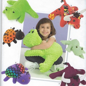 May include: Simplicity pattern featuring various stuffed animal designs. Includes a green frog, a ladybug, a turtle with a rainbow shell, a red bull, and a green frog. The pattern is one size.