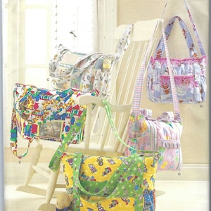 May include: A Simplicity sewing pattern envelope 2713 for one size bags. The cover displays five different tote bags with various colorful patterns, including animal prints, floral designs, and cartoon motifs, featuring shoulder straps and pockets.