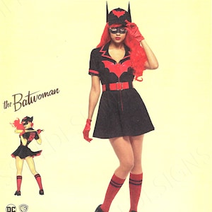 May include: Simplicity pattern for a Batwoman costume from DC Comics Bombshells. The costume features a black dress with a red bat symbol, matching gloves, and a cap with bat ears. The image includes the text "the Batwoman".