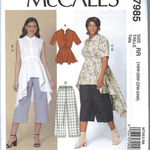 Può includere: Modello di cucito per una blusa e pantaloni da donna. La blusa ha un collo alto e rotondo e un orlo lungo e fluido. I pantaloni sono a gamba larga e corti. Il modello è disponibile nelle taglie 18W-20W-22W-24W. McCall's M7985.