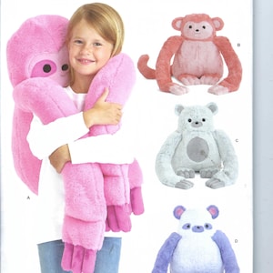 May include: Simplicity sewing pattern S9442 featuring plush animal designs. The image shows a girl holding a pink plush sloth. Other designs include a monkey, a bear, and a panda. The pattern is one size and designed and printed in the USA.