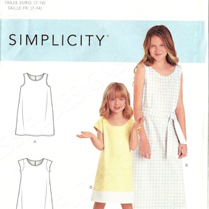 May include: Simplicity sewing pattern R10511 for girls' dresses. The pattern includes illustrations of different dress styles, with two girls modeling the finished garments. One dress is yellow with a white hem, and the other is a white and light blue gingham print.