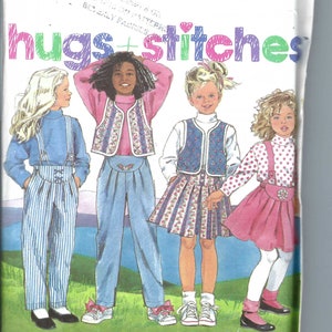 May include: A sewing pattern for children's clothing, featuring four girls wearing different outfits. The pattern is called "hugs + stitches" and is from Simplicity. The pattern number is 9889.