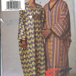 May include: A white ceramic mug with a black handle and the text "But First, Coffee" in a handwritten style. The mug is on a white surface. The mug is 4 inches tall.