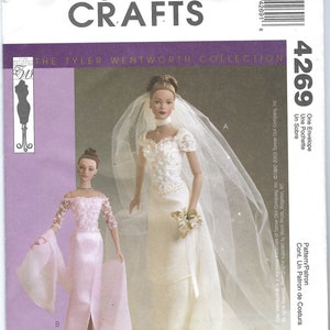 May include: A sewing pattern for a doll's wedding dress and a matching evening gown. The pattern is from McCall's Crafts and is part of The Tyler Wentworth Collection. The pattern number is 4269.