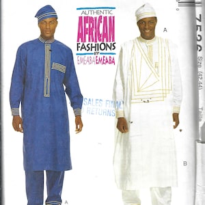May include: McCall's sewing pattern featuring two African fashion designs. One design is a blue tunic and pants with gold trim, and the other is a white tunic and pants with gold geometric accents. The pattern includes the text "AUTHENTIC AFRICAN FASHIONS".