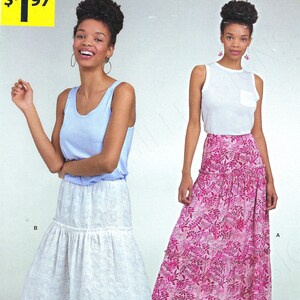 May include: A sewing pattern for two skirts. The pattern is called "IT'S SO EASY" and is from Simplicity. The pattern number is A8678. The price is $197. The skirts are both tiered and have a floral print. One skirt is white and the other is pink.