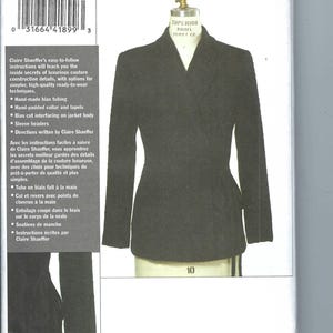 May include: A sewing pattern envelope for V8428 Claire Shaeffer's Custom Couture Collection, featuring a black blazer displayed on a dress form. The envelope includes text details about couture construction techniques and sizing for 12-14-16.