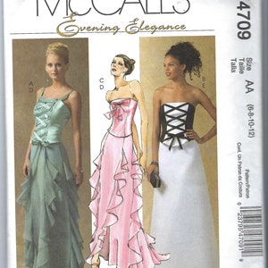 May include: A sewing pattern for a formal evening gown with three different styles. The pattern is for sizes 6-8-10-12 and is called McCall's Evening Elegance M4709.