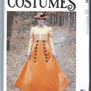 Puede incluir: Un patrón de costura vintage para un disfraz de mujer. El patrón es para una falda larga de color naranja con un corpiño abotonado y una blusa a rayas. El patrón es de McCall's Costumes y es de talla A5 (6-8-10-12-14).