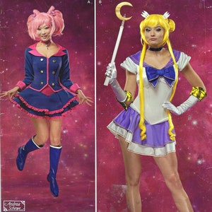 May include: Simplicity sewing pattern S0254 H5, featuring two cosplay costume designs. One design is a blue and pink sailor-style outfit, and the other is a white, purple, and blue sailor-style costume. The pattern size is U.S. 6-14.