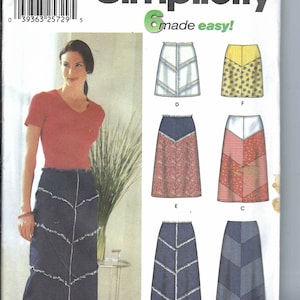 May include: Sewing pattern Simplicity 7179 for a skirt with six different variations. The pattern includes a denim skirt with a zig-zag design, a floral print skirt, a red and white plaid skirt, a blue and white striped skirt, a white skirt with a zig-zag design, and a yellow floral print skirt. The pattern is for sizes 4, 6, 8, and 10.