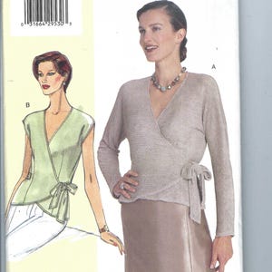 May include: A sewing pattern for a wrap top with long sleeves and a tie at the waist. The pattern is for sizes D-E-F and is from Today's Fit by Sandra Betzina.