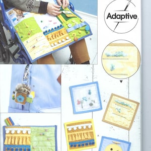 May include: Simplicity pattern S9575 featuring adaptive sewing projects. The image shows a variety of colorful fabric squares with different textures, buttons, and embellishments. One project is a lap pad with various interactive elements.