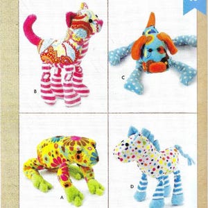 May include: Image of a sewing pattern for plush animals. The pattern features four colorful stuffed animal designs: a cat, a dog, a frog, and a horse. The animals are made of patterned fabric and have striped legs.