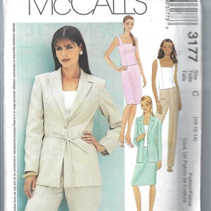 May include: McCall's sewing pattern 3177 featuring illustrations of women's suits and separates. The pattern includes a beige suit with a belted jacket and pants, and other designs in pink and mint green. The pattern size is C (10-12-14).