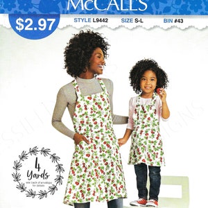 May include: Sew Simple McCall's sewing pattern for a strawberry print apron. The pattern is for sizes S-L and requires 4 yards of fabric. The pattern is made in the USA.