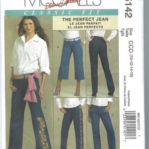 May include: McCall's Classic Fit sewing pattern M5142. The pattern features various styles of The Perfect Jean, including flared and embellished designs. The cover displays images of the jeans and includes text in English, French, and Spanish.