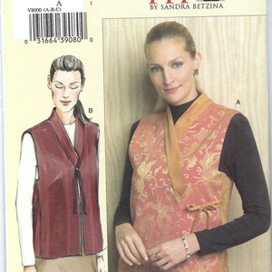 May include: A sewing pattern for a vest, labeled V8000, with a woman wearing a vest with a gold and red floral pattern. The pattern includes illustrations of the vest design. The text "TODAY'S FIT" is also visible.