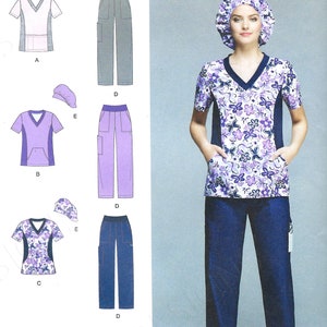 May include: A sewing pattern for a scrub top and pants. The pattern includes three different top designs: a solid pink and grey top, a solid lavender top, and a floral print top. The pattern also includes three different pant designs: grey pants, lavender pants, and navy blue pants. The pattern is for sizes 20W-28W. The pattern is designed and printed in the USA.