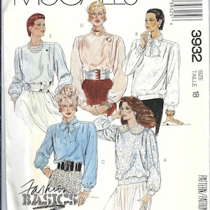May include: McCall's sewing pattern featuring illustrations of blouses with various designs. The pattern includes a size 18. The text "Fashion Basics" is visible. The overall color scheme is light and vintage.