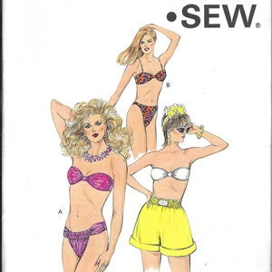 May include: A sewing pattern for a swimsuit with three different styles. The pattern is called "KWIK •SEW" and is for sizes 12-14-16-18. The pattern includes a strapless bikini top, a halter bikini top, and a pair of high-waisted shorts.