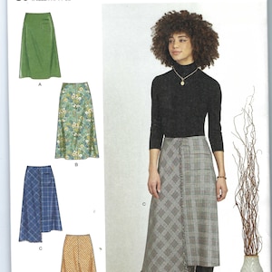 May include: A sewing pattern for four different skirts. The pattern is called Simplicity S9648 and is for sizes US 16-24, Euro 42-50, and French 44-52. The skirts are shown in green, floral print, plaid, and yellow.