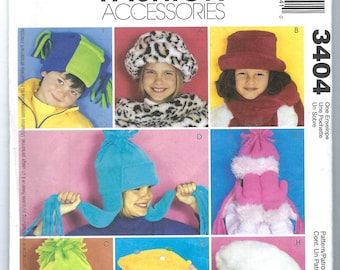 May include: A sewing pattern for eight different children's hats. The hats are in various colors and styles, including a leopard print, a plain red hat, a blue hat with ear flaps, a yellow beret, and a white hat with a fur trim. The pattern is called McCall's Fashion Accessories 3404.