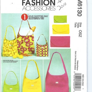 Puede incluir: Patrón de costura McCall's Fashion Accessories M6130. El patrón presenta diseños de bolsas de compras con estampados de limones, flores y geométricos. También incluye instrucciones para pequeños bolsos de mano.