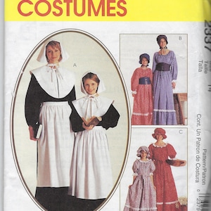 Puede incluir: Un patrón de costura para tres trajes de peregrinos. El patrón incluye un vestido de manga larga con cuello blanco y falda larga, un vestido de manga larga con cuello blanco y falda larga, y un vestido de manga larga con cuello blanco y falda larga. El patrón es para las tallas 14, 16 y 18.