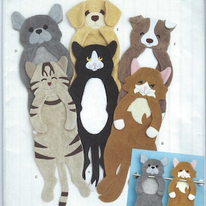 May include: A sewing pattern for making plush animal towel holders. The pattern includes instructions for making a cat, dog, and a variety of other animals. The pattern is from Simplicity and is designed by Carla Reiss.