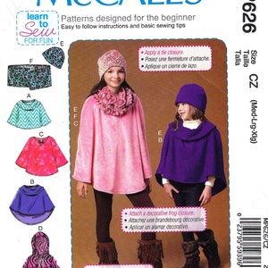 May include: A sewing pattern for a child's poncho with a decorative frog closure. The pattern includes instructions for a tie closure, a machine stitched hem, and a decorative frog closure. The pattern is for sizes medium, large, and extra large.