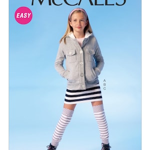 May include: A young person wearing a gray hooded jacket with a white trim, a black and white striped skirt, gray and white striped knee-high socks, and black shoes with floral accents. The image includes the text "McCALL'S" and "EASY".