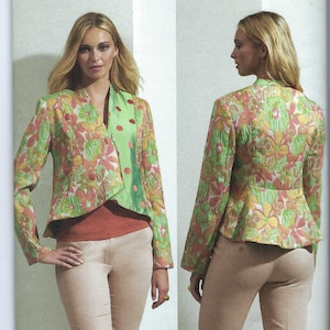 May include: Vogue Patterns sewing pattern for a green and pink floral print jacket with a contrasting green collar and a V-neckline. The pattern is for sizes 6-8-10-12-14 and is designed by Júlio César NYC.