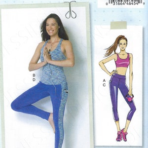 May include: A sewing pattern package featuring a woman in athletic wear. The package includes a blue and gray tank top and blue leggings with a side pocket. The package also shows a drawing of a woman in a pink sports bra and purple leggings.