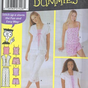 May include: Simplicity Sewing Patterns for Dummies pattern 5205 for juniors and juniors plus loungewear. The pattern includes three different styles of pajamas with a pink and white color scheme. The pattern includes extended sizing.