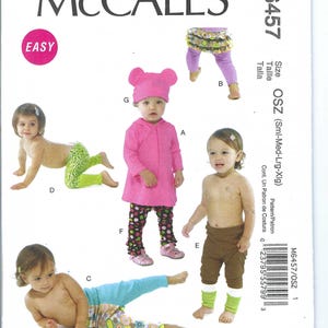 May include: A sewing pattern for making baby leggings and a hooded top. The pattern includes four different styles of leggings and a hooded top with bear ears. The pattern is for sizes small, medium, large, and extra large.