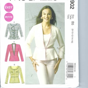 May include: A sewing pattern for a jacket with a peplum. The pattern is for sizes 8-10-12-14-16. The pattern is called McCall's M6902 and is labeled as easy and petite.