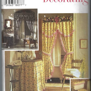 May include: Simplicity Home Decorating sewing pattern number 9595 for a bathroom curtain set. The pattern includes instructions for a ruffled shower curtain, a valance, and a toilet seat cover. The pattern is for one size.